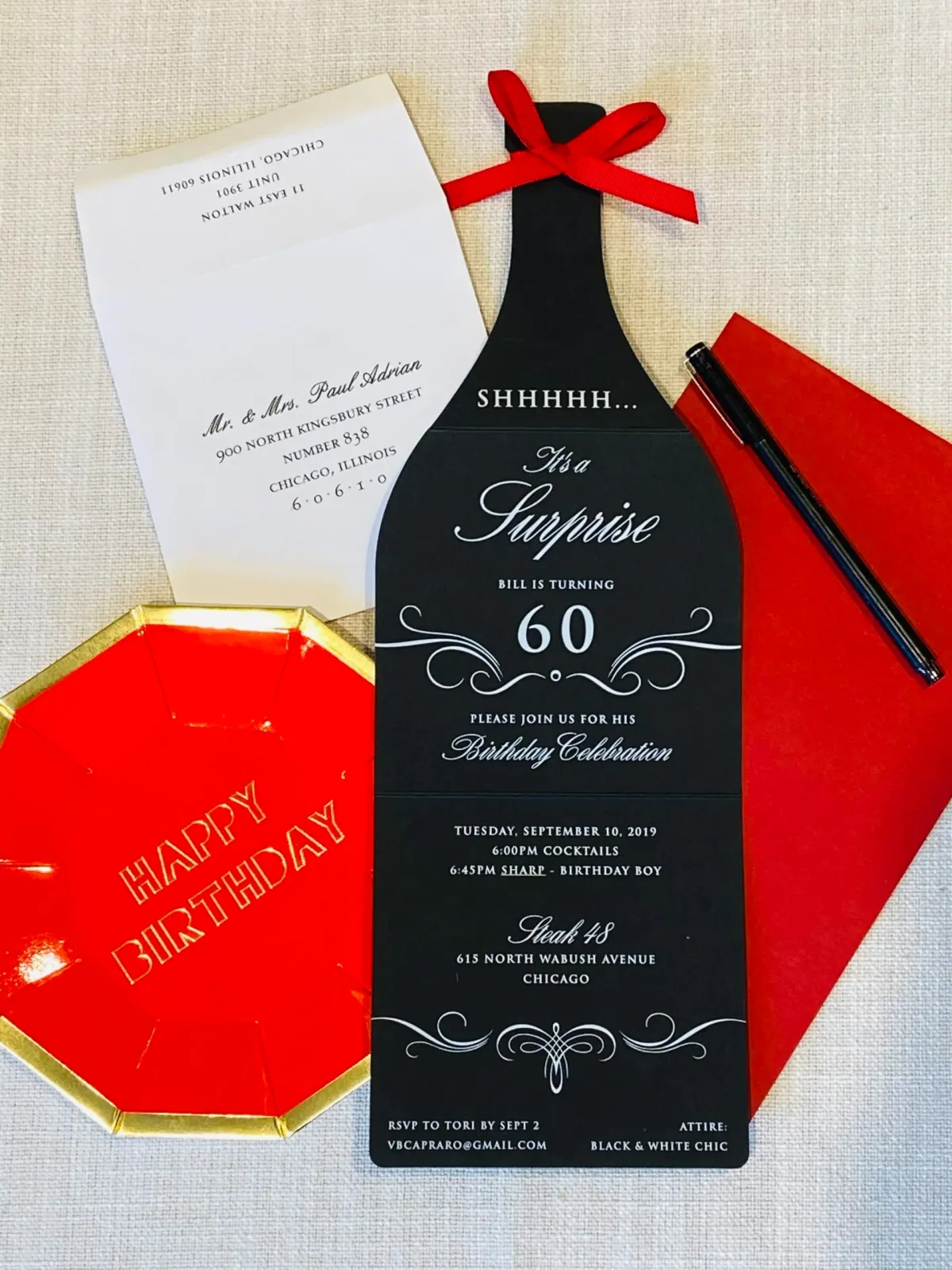 Bottle-shaped surprise 60th birthday invitation with orange envelope