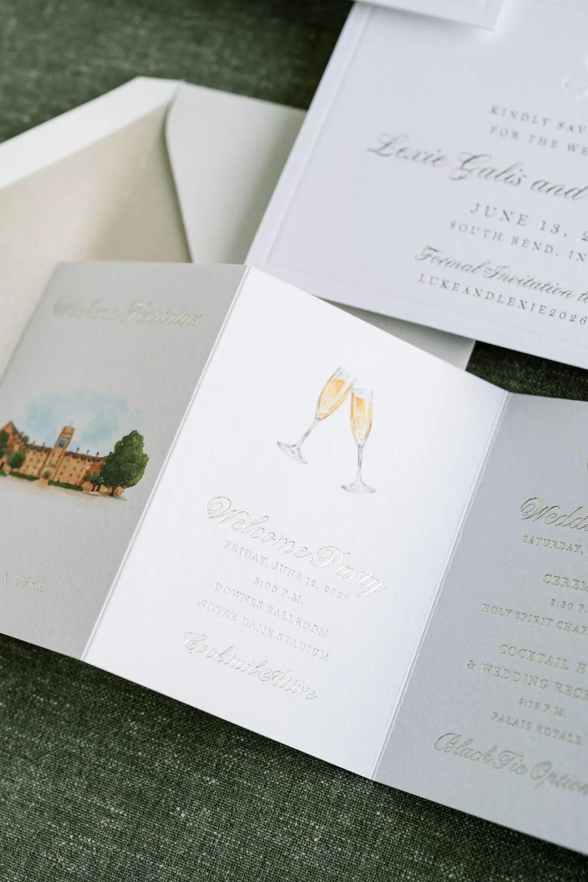 Folded save the date booklet with champagne toast and venue illustrations