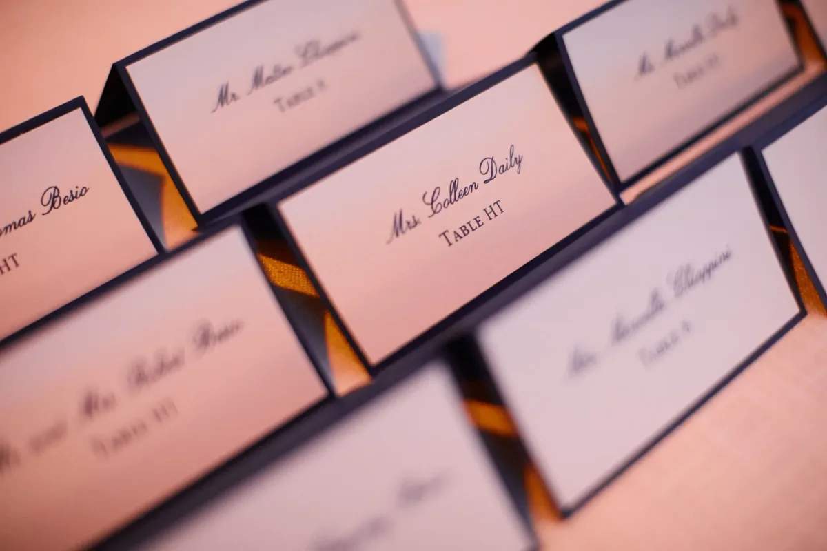 Blush escort cards with script names