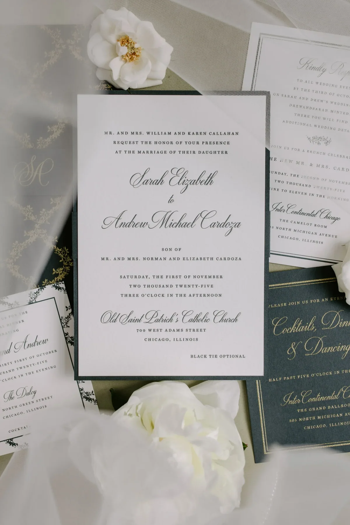 Black-bordered wedding invitation with dark green and gold accompanying cards