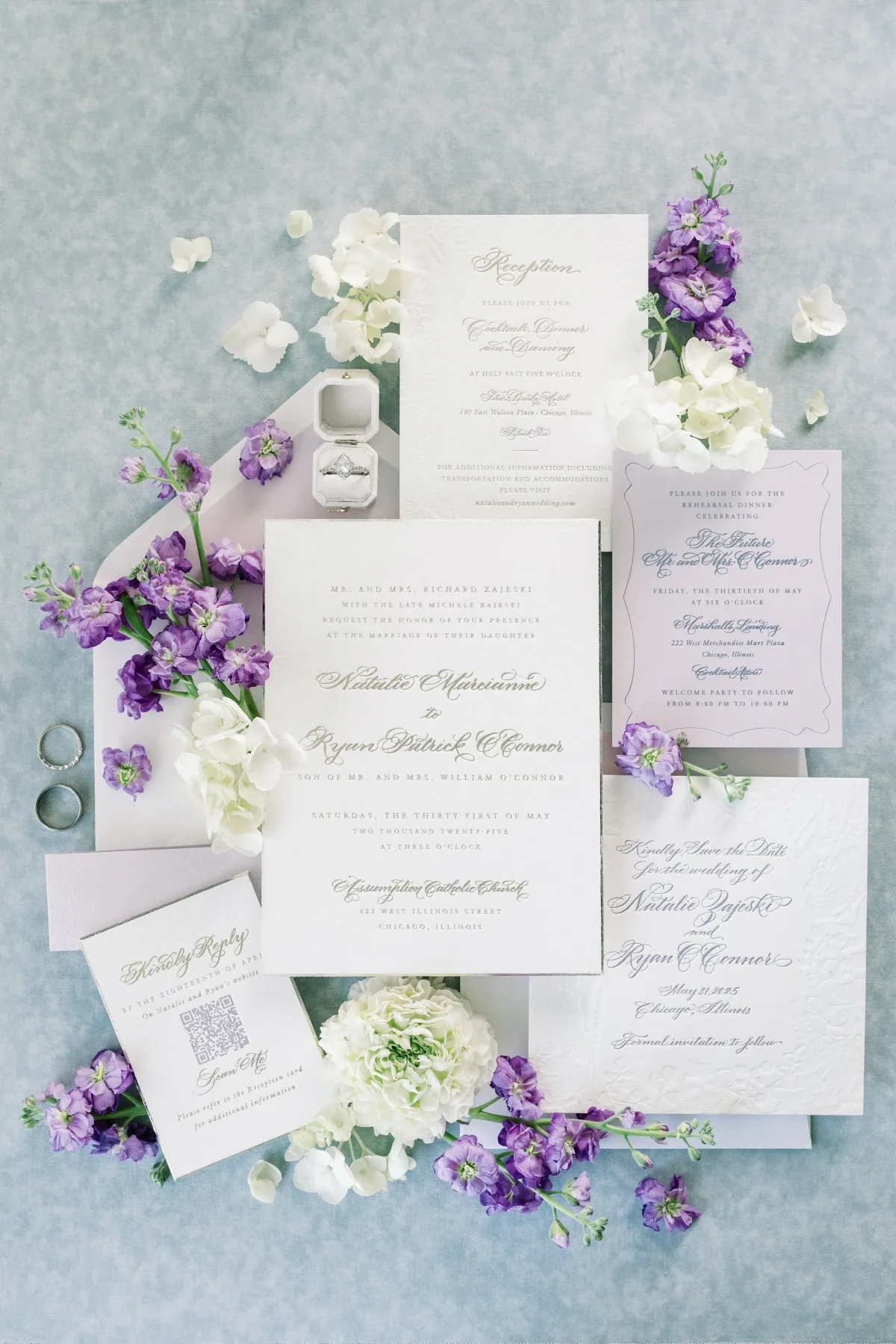 Lavender and white wedding suite styled with purple blooms