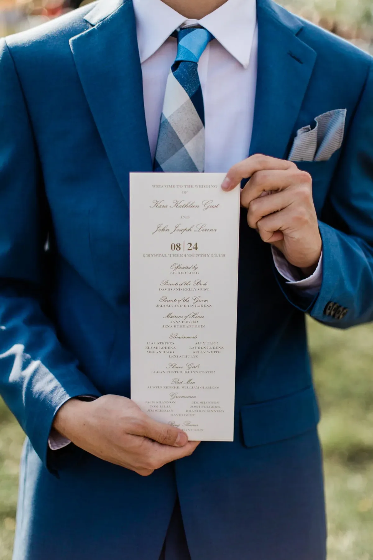 Groom holding a ceremony program
