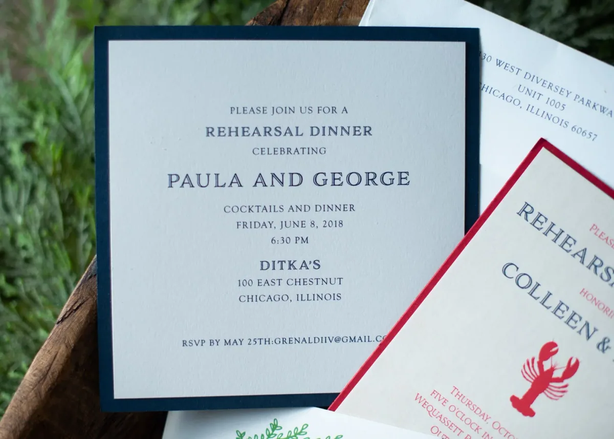Navy-bordered rehearsal dinner invitation