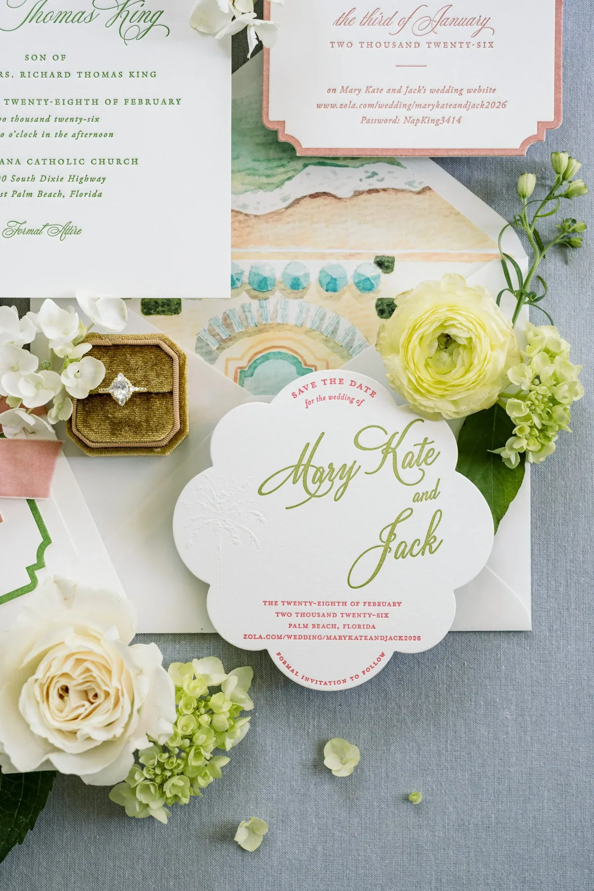 Close detail of green script on a scalloped save the date